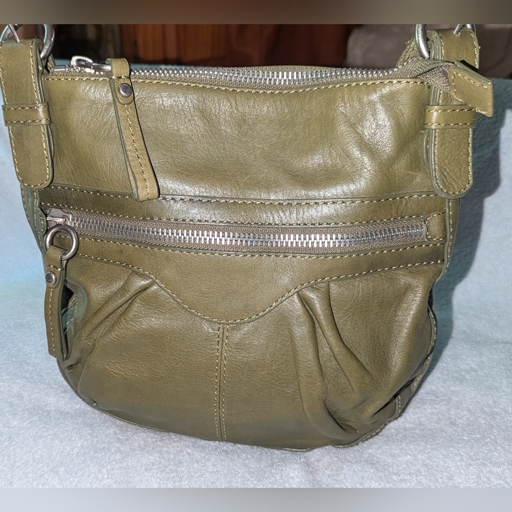 Fossil green messenger crossbody bag .